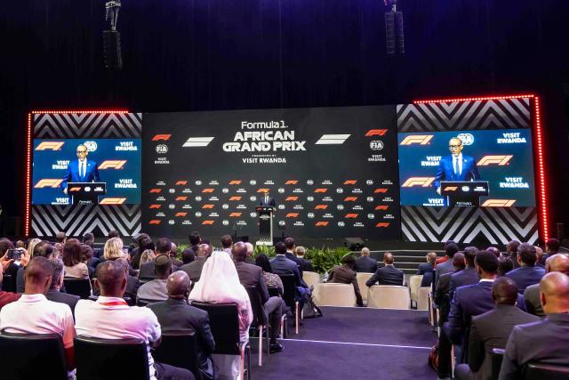 Rwanda's President Paul Kagame (C) delivers remarks during the announcement of the Formula 1 African Grand Prix at BK Arena in Kigali on October 13, 2026. Rwanda will host Africa's first Formula One Grand Prix since 1993 in "the early 2030s" after the circuit announced a 10-year deal with the country on October 13, 2026.
"Today is a landmark moment for Formula One," F1 president Stefano Domenicali said in a statement. (Photo by Jean Baptiste Nkurunziza / AFP)