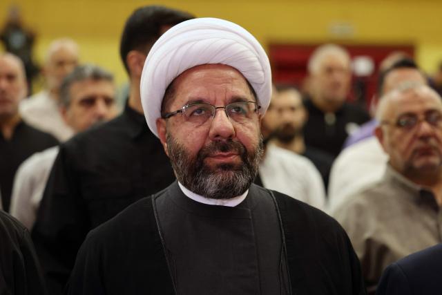 The head of Hezbollah's Executive Council, Ali Damoush arrives to address a press conference in the southern suburbs of Beirut on October 13, 2026. (Photo by Anwar AMRO / AFP)