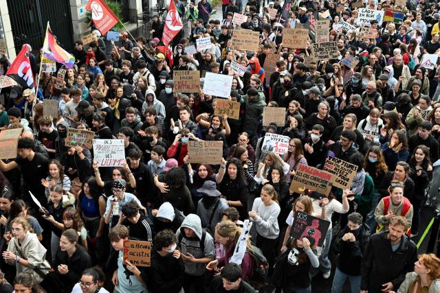 Young protesters hold placards while taking part in a demonstration of high-school students in Nantes, western France on October 13, 2026, as part of a nationwide high school mobilisation over learning conditions. France sees nationwide demonstrations on October 13 in support of students protesting poor classroom conditions for weeks, as authorities and participants remain wary of further violence. (Photo by Sebastien Salom-Gomis / AFP)