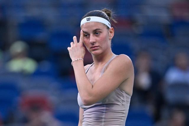 Ukraine's Marta Kostyuk reacts during her women’s singles match against Greece's Maria Sakkari at the Wuhan Open tennis tournament in Wuhan, China's Hubei province on October 13, 2026. (Photo by WANG Zhao / AFP)