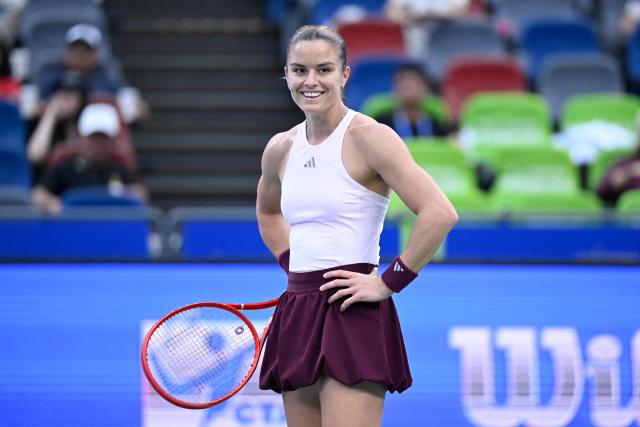 Greece's Maria Sakkari reacts during her women’s singles match against Ukraine's Marta Kostyuk at the Wuhan Open tennis tournament in Wuhan, China's Hubei province on October 13, 2026. (Photo by WANG Zhao / AFP)