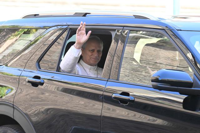 Pope Leo XIV leaves the Vatican before being admitted to Rome's Gemelli University Hospital for an operation to remove a lump from his lung, in the Vatican on 13 October 2026.  (Photo by Tiziana FABI / AFP)