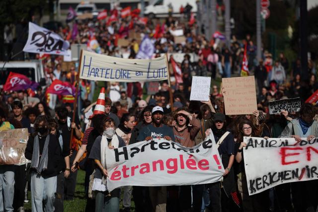 Protesters hold placards and banners during a demonstration of high-school students in Brest, western France on October 13, 2026, as part of a nationwide high school mobilisation. France sees nationwide demonstrations on October 13 in support of students protesting poor classroom conditions for weeks, as authorities and participants remain wary of further violence. (Photo by FRED TANNEAU / AFP)