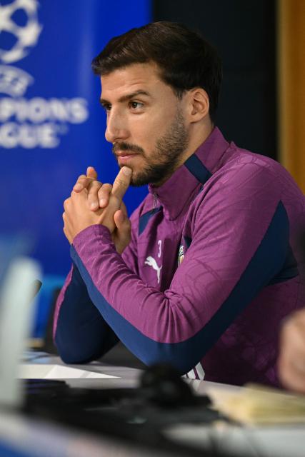 Manchester City's Portuguese defender #03 Ruben Dias attends a press conference at the Etihad Campus training ground in Manchester, north-west England, on October 13, 2026, on the eve of their UEFA Champions League, league phase football match against PSG. (Photo by Oli SCARFF / AFP)