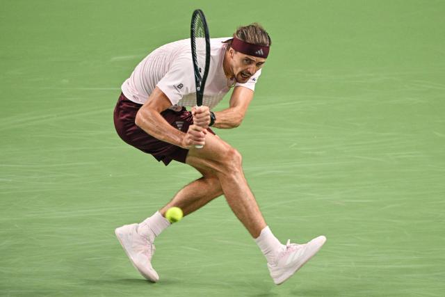 Germany's Alexander Zverev hits a return to Kazakhstan's Alexander Bublik during their men's singles match at the Shanghai Masters tennis tournament in Shanghai on October 13, 2026. (Photo by Hector RETAMAL / AFP)