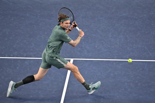 Kazakhstan's Alexander Bublik hits a return to Germany's Alexander Zverev during their men's singles match at the Shanghai Masters tennis tournament in Shanghai on October 13, 2026. (Photo by Hector RETAMAL / AFP)