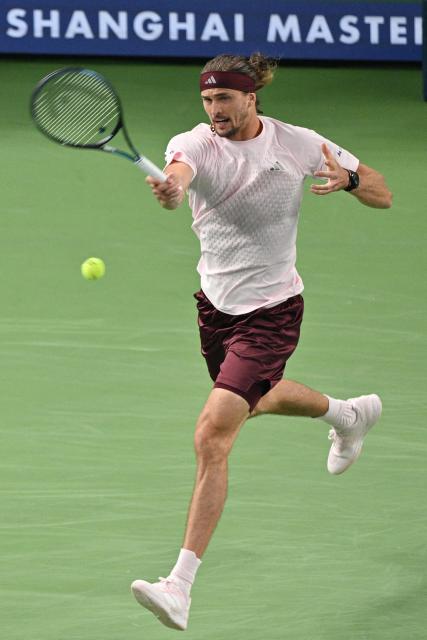 Germany's Alexander Zverev hits a return to Kazakhstan's Alexander Bublik during their men's singles match at the Shanghai Masters tennis tournament in Shanghai on October 13, 2026. (Photo by Hector RETAMAL / AFP)