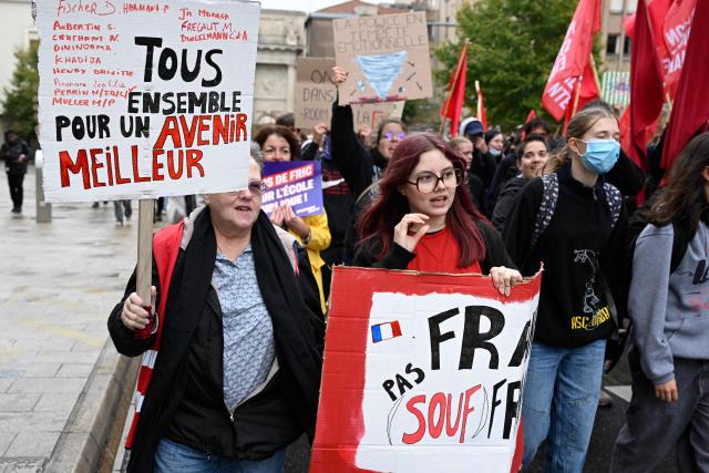 Protesters hold placards during a demonstration of high-school students in Nancy, northeastern France on October 13, 2026, as part of a nationwide high school mobilisation. France sees nationwide demonstrations on October 13 in support of students protesting poor classroom conditions for weeks, as authorities and participants remain wary of further violence. (Photo by Jean-Christophe VERHAEGEN / AFP)
