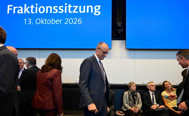 German Chancellor Friedrich Merz (C) arrives to attend a meeting with the parliamentary group of his conservative 
Christian Democratic Union (CDU) party in Berlin, on October 13, 2026. (Photo by John MACDOUGALL / AFP)
