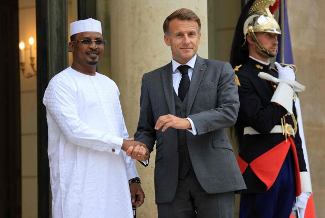 France's President Emmanuel Macron (R) welcomes Chad's President Mahamat Idriss Deby Itno at The Elysee Presidential Palace in Paris on October 13, 2026. French President Emmanuel Macron hosts Chadian counterpart Mahamat Idriss Deby Itno in Paris as the two rebuild ties nearly two years after N'Djamena ordered French forces off its soil, officials said. (Photo by Ludovic MARIN / AFP)