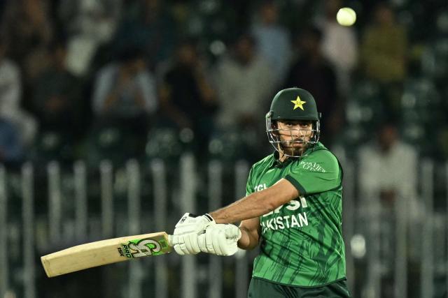 Pakistan's Arafat Minhas plays a shot during the third T20 international cricket match between Pakistan and Sri Lanka at the Rawalpindi Cricket Stadium in Rawalpindi on October 13, 2026. (Photo by FAROOQ NAEEM / AFP)
