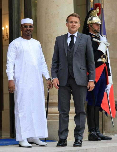 France's President Emmanuel Macron (R) welcomes Chad's President Mahamat Idriss Deby Itno at the Elysee Presidential Palace in Paris on October 13, 2026. French President Emmanuel Macron hosts Chadian counterpart Mahamat Idriss Deby Itno in Paris as the two rebuild ties nearly two years after N'Djamena ordered French forces off its soil, officials said. (Photo by Ludovic MARIN / AFP)