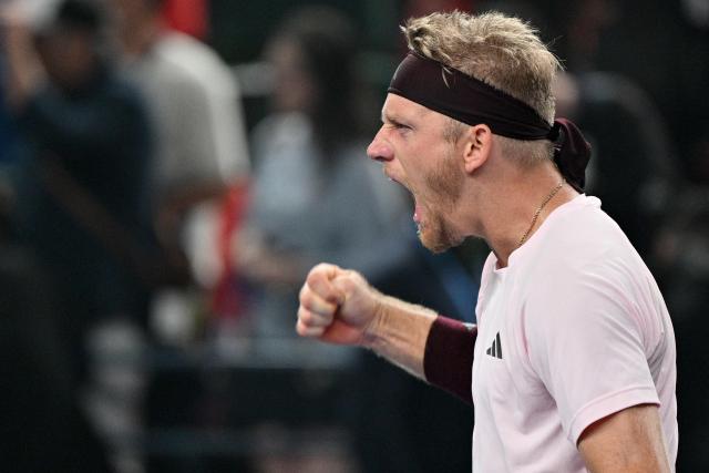 Spain's Alejandro Davidovich Fokina celebrates his victory against Poland's Hubert Hurkacz during their men's singles match at the Shanghai Masters tennis tournament in Shanghai on October 13, 2026. (Photo by Hector RETAMAL / AFP)