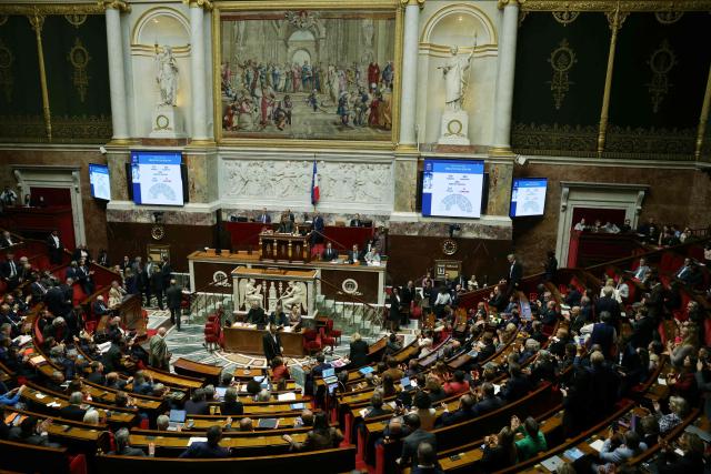 Members of Parliament applaud after the vote on the comprehensive law on gender-based and sexual violence at the National Assembly, French Parliament's lower house, in Paris on October 13, 2026. The National Assembly has unanimously passed the comprehensive bill aimed at combating sexual and gender-based violence. (Photo by Thomas SAMSON / AFP)
