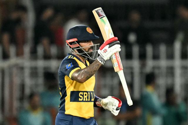 Sri Lanka's captain Kusal Mendis celebrates after scoring a half-century (50 runs) during the third T20 international cricket match between Pakistan and Sri Lanka at the Rawalpindi Cricket Stadium in Rawalpindi on October 13, 2026. (Photo by FAROOQ NAEEM / AFP)