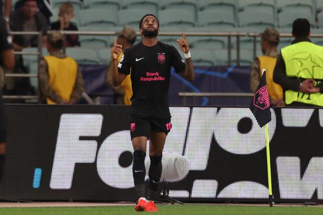 Sabah FK's Jamaican midfielder #11 Kaheem Parris celebrates after scoring the team's first goal during the UEFA Champions League match between Sabah and Slavia Praha at the Baku Olympic Stadium in Baku on October 13, 2026. (Photo by Giorgi ARJEVANIDZE / AFP)