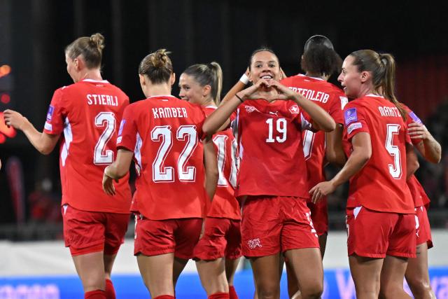 Switzerland's forward #19 Iman Beney (C) celebrates scoring her team's first goal during the Women’s FIFA World Cup 2027 qualifyers play-off football match between Switzerland and Israel at Stade de Tourbillon in Sion, Switzerland, on October 13, 2026. (Photo by Fabrice COFFRINI / AFP)