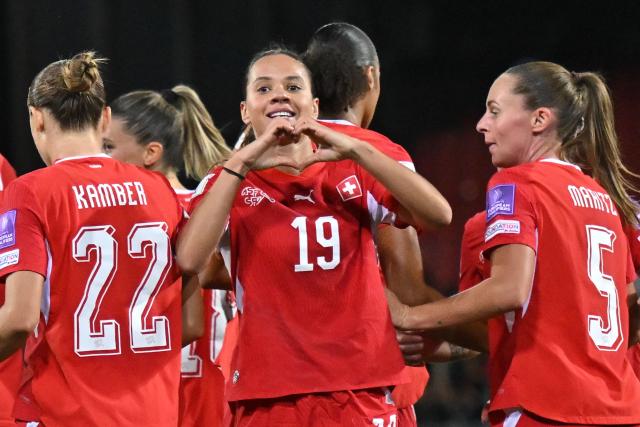 Switzerland's forward #19 Iman Beney (C) celebrates scoring her team's first goal during the Women’s FIFA World Cup 2027 qualifyers play-off football match between Switzerland and Israel at Stade de Tourbillon in Sion, Switzerland, on October 13, 2026. (Photo by Fabrice COFFRINI / AFP)