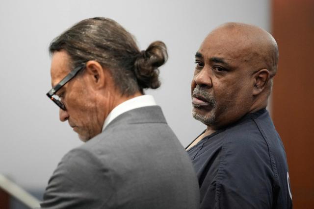 Duane Davis (R) stands with his attorney Michael Sanft during his sentencing hearing in the 1996 killing of rapper Tupac Shakur, at Clark County District Court at the Regional Justice Center in Las Vegas, Nevada, on October 13, 2026. Davis, a former Los Angeles gang member, will be sentenced today after being found guilty on August 31, 2026 by a Las Vegas court, thirty years after the rap legend's death in Las Vegas. (Photo by John Locher / POOL / AFP)