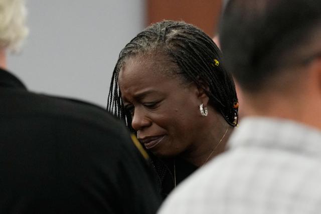 Sekyiwa “Set” Shakur (C), attends the trial of Duane Davis during a sentencing hearing after Davis’ murder conviction in the killing of rapper Tupac Shakur, at Clark County District Court at the Regional Justice Center in Las Vegas, Nevada, on October 13, 2026. Davis, a former Los Angeles gang member, will be sentenced today after being found guilty on August 31, 2026 by a Las Vegas court, thirty years after the rap legend's death in Las Vegas. (Photo by John Locher / POOL / AFP)