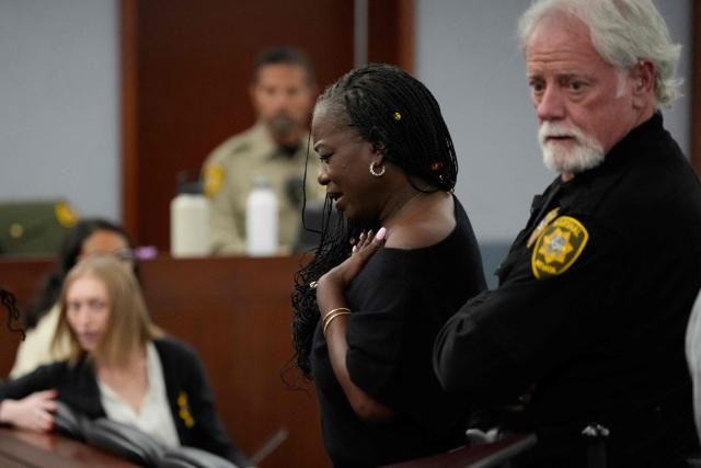 Sekyiwa “Set” Shakur (C), attends the trial of Duane Davis during a sentencing hearing after Davis’ murder conviction in the 1996 killing of rapper Tupac Shakur, at Clark County District Court at the Regional Justice Center in Las Vegas, Nevada, on October 13, 2026. Davis, a former Los Angeles gang member, will be sentenced today after being found guilty on August 31, 2026 by a Las Vegas court, thirty years after the rap legend's death in Las Vegas. (Photo by John Locher / POOL / AFP)