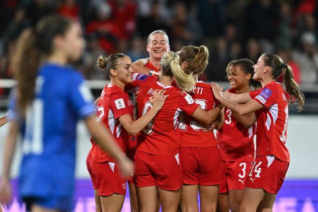 Switzerland's defender #02 Julia Stierli (C) celebrates scoring the team's second goal during the Women’s FIFA World Cup 2027 qualifyers play-off football match between Switzerland and Israel at Stade de Tourbillon in Sion, Switzerland, on October 13, 2026. (Photo by Fabrice COFFRINI / AFP)