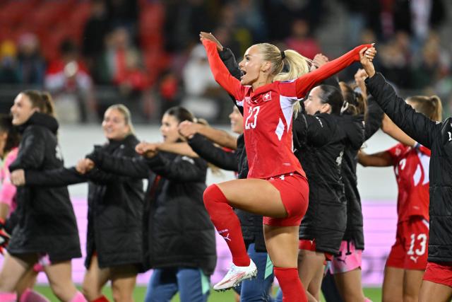 Switzerland's forward #23 Alisha Lehmann celebrates the team's victory at the end of the Women’s FIFA World Cup 2027 qualifyers play-off football match between Switzerland and Israel at Stade de Tourbillon in Sion, Switzerland, on October 13, 2026. (Photo by Fabrice COFFRINI / AFP)