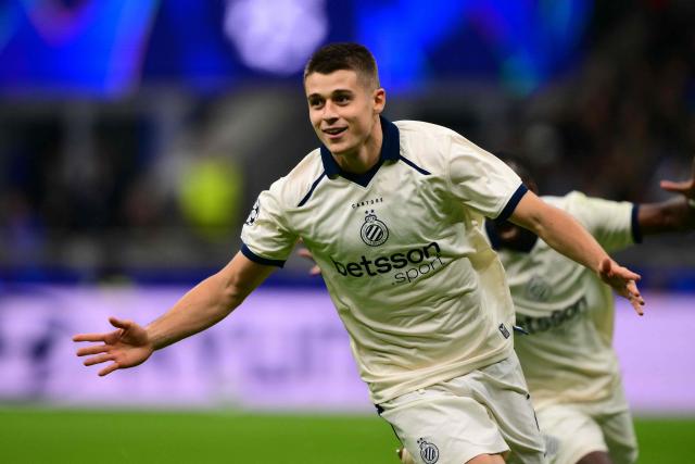 Club Brugge's German forward #07 Nicolo Tresoldi celebrates scoring his team's second goal with teammates during the UEFA Champions League first round day 2 football match between Inter Milan and Club Brugge at San Siro stadium in Milan, on October 13, 2026 (Photo by Marco BERTORELLO / AFP)