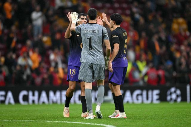 Barcelona's Spanish defender #18 Gerard Martin (L), Barcelona's Spanish goalkeeper #01 Joan Garcia (C) and Barcelona's Spanish defender #05 Pau Cubarsi (R) celebrate their team's victory at the end of the UEFA Champions League, league phase matchday 2, football match between Galatasaray and Barcelona at the Ali Sami Yen Sports Complex in Istanbul on October 13, 2026. (Photo by Ozan KOSE / AFP)