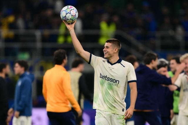 Scorer Club Brugge's German forward #07 Nicolo Tresoldi celebrates after winning the UEFA Champions League first round day 2 football match between Inter Milan and Club Brugge at San Siro stadium in Milan, on October 13, 2026 (Photo by Marco BERTORELLO / AFP)