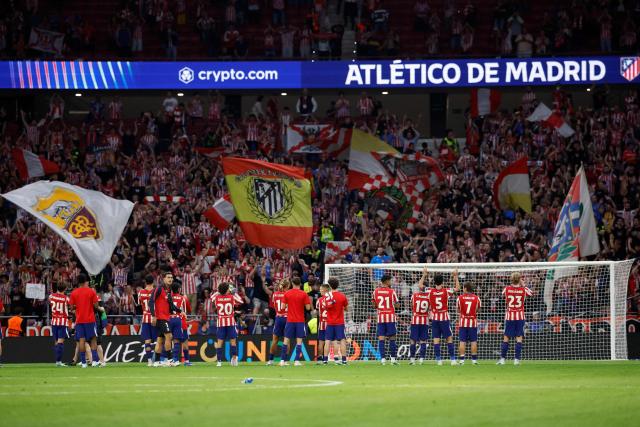 Atletico Madrid's players celebrate victory at the end of the UEFA Champions League, league phase, matchday 2, football match between Club Atletico de Madrid and Manchester United at the Metropolitano stadium in Madrid on October 13, 2026. Atletico Madrid won 2-0. (Photo by Oscar DEL POZO / AFP)