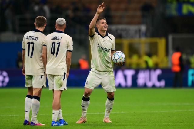 Scorer Club Brugge's German forward #07 Nicolo Tresoldi celebrates after winning the UEFA Champions League first round day 2 football match between Inter Milan and Club Brugge at San Siro stadium in Milan, on October 13, 2026 (Photo by Marco BERTORELLO / AFP)