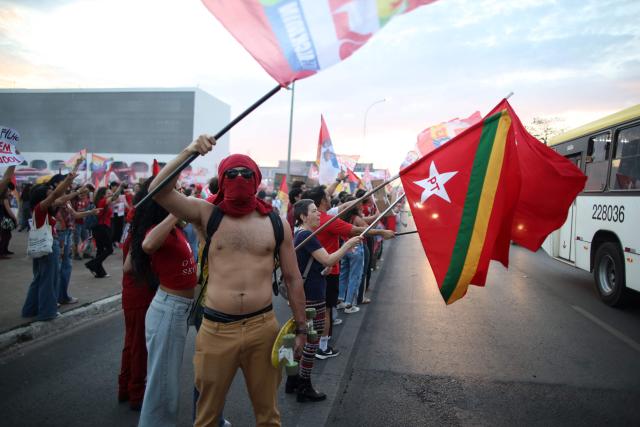 Supporters of Brazil's President and presidential candidate Luiz Inacio Lula da Silva attend a campaign rally on the Esplanade of Ministries in Brasilia on October 13, 2026, ahead of the October 25 presidential runoff. (Photo by Sergio Lima / AFP)
