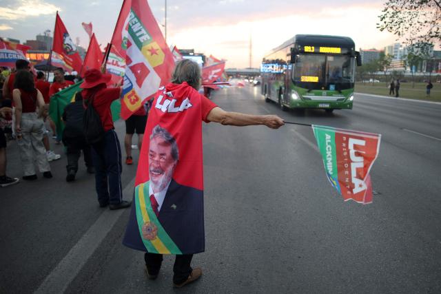 Supporters of Brazil's President and presidential candidate Luiz Inacio Lula da Silva attend a campaign rally on the Esplanade of Ministries in Brasilia on October 13, 2026, ahead of the October 25 presidential runoff. (Photo by Sergio Lima / AFP)