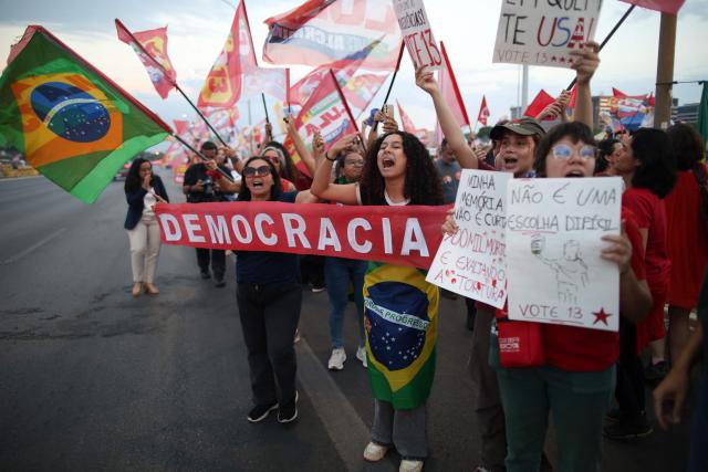 Supporters of Brazil's President and presidential candidate Luiz Inacio Lula da Silva attend a campaign rally on the Esplanade of Ministries in Brasilia on October 13, 2026, ahead of the October 25 presidential runoff. (Photo by Sergio Lima / AFP)