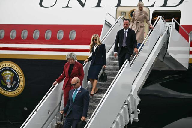 (L-R) White House Chief of Staff Susie Wiles, White House Chief of Staff Susie Wiles, White House Press Secretary Katie Zacharia, White House Deputy Chief of Staff Dan Scavino and Executive Assistant to President Donald Trump Natalie Harp disembark Air Force One at Elmendorf Air Force Base in Anchorage, Alaska, on October 13, 2026. President Trump is traveling to Wasilla, Alaska to hold a campaign rally ahead of the midterm elections. (Photo by Kent NISHIMURA / AFP)