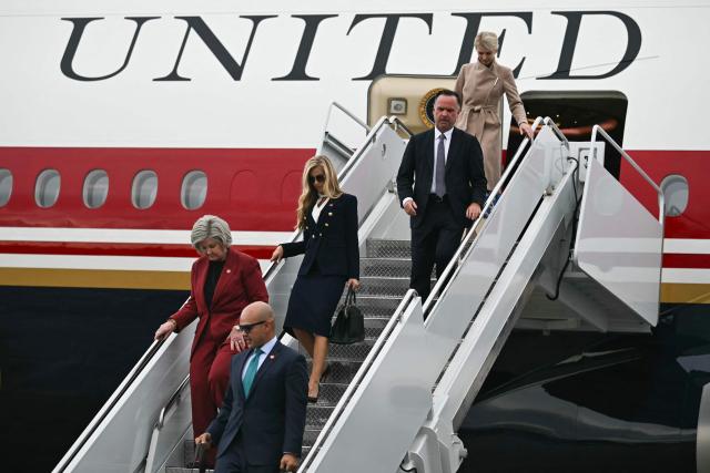(L-R) White House Chief of Staff Susie Wiles, White House Chief of Staff Susie Wiles, White House Press Secretary Katie Zacharia, White House Deputy Chief of Staff Dan Scavino and Executive Assistant to President Donald Trump Natalie Harp disembark Air Force One at Elmendorf Air Force Base in Anchorage, Alaska, on October 13, 2026. President Trump is traveling to Wasilla, Alaska to hold a campaign rally ahead of the midterm elections. (Photo by Kent NISHIMURA / AFP)