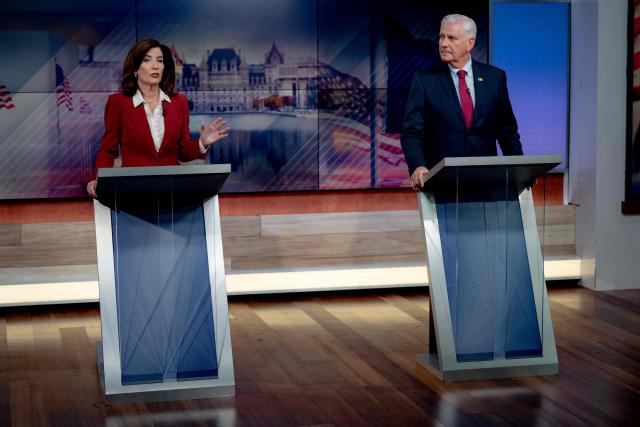 New York Governor Kathy Hochul and Republican candidate Bruce Blakeman face off in a televised debate at the Spectrum News NY1 studios in New York on October 13, 2026. (Photo by Anna CONNORS / POOL / AFP)