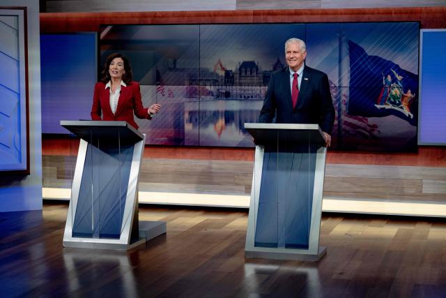 New York Governor Kathy Hochul and Republican candidate Bruce Blakeman face off in a televised debate at the Spectrum News NY1 studios in New York on October 13, 2026. (Photo by Anna CONNORS / POOL / AFP)