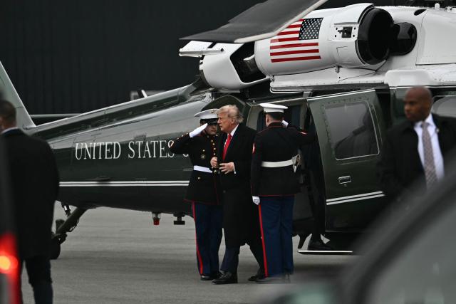 US President Donald Trump steps off Marine One upon arrival to Wasilla Airport in Wasilla, Alaska, on October 13, 2026. President Trump is in Alaska to hold a campaign rally ahead of the midterm elections. (Photo by Kent NISHIMURA / AFP)