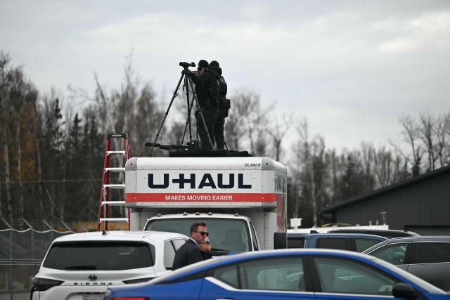 Security personnel are seen at Wasilla Airport in Wasilla, Alaska, on October 13, 2026. US President Donald Trump is in Alaska to hold a campaign rally ahead of the midterm elections. (Photo by Kent NISHIMURA / AFP)