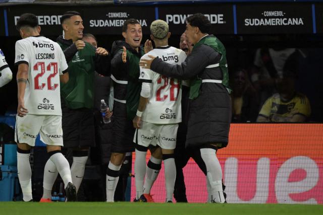 Vasco da Gama's midfielder #28 Adson celebrates with teammates after scoring his team's first goal during the Copa Sudamericana semifinal first leg football match between Argentina's Boca Juniors and Brazil's Vasco da Gama at the Bombonera stadium in Buenos Aires on October 13, 2026. (Photo by JUAN MABROMATA / AFP)