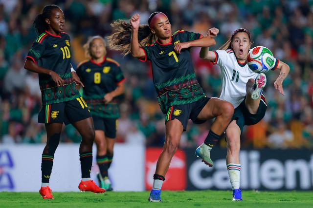 Mexico's forward #7 Alice Soto and Jamaica’s forward #11 Khadija Shaw fight for the ball during the women's international friendly football match between Mexico and Jamaica at La Corregidora Stadium in Santiago de Queretaro, Queretaro State, Mexico on October 13, 2026. (Photo by Cesar Gomez / AFP)