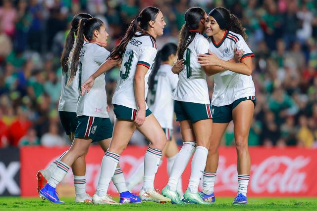 Mexico's midfielder #24 Maricarmen Reyes (2nd R) celebrates scoring his team's second goal during the women's international friendly football match between Mexico and Jamaica at La Corregidora Stadium in Santiago de Queretaro, Queretaro State, Mexico on October 13, 2026. (Photo by Cesar Gomez / AFP)