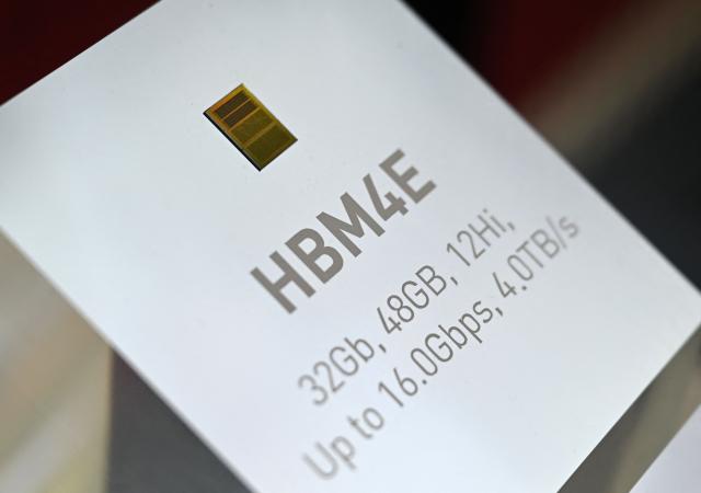 A display for SK hynix's HBM4E chip is seen during a semiconductor exhibition at the COEX convention and exhibition centre in Seoul on October 14, 2026. (Photo by Jung Yeon-je / AFP)
