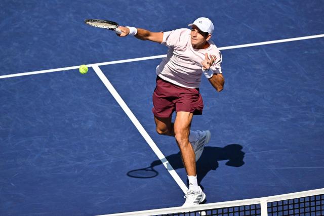Spain's Rafael Jodar hits a return to Netherlands' Botic van de Zandschulp during their men's singles match at the Shanghai Masters tennis tournament in Shanghai on October 14, 2026. (Photo by Hector RETAMAL / AFP)