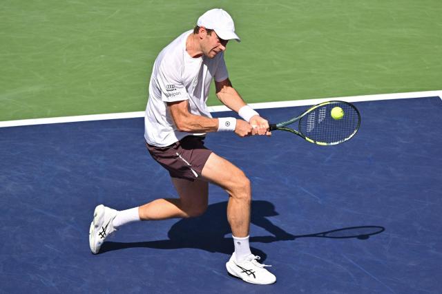Netherlands' Botic van de Zandschulp hits a return to Spain's Rafael Jodar during their men's singles match at the Shanghai Masters tennis tournament in Shanghai on October 14, 2026. (Photo by Hector RETAMAL / AFP)