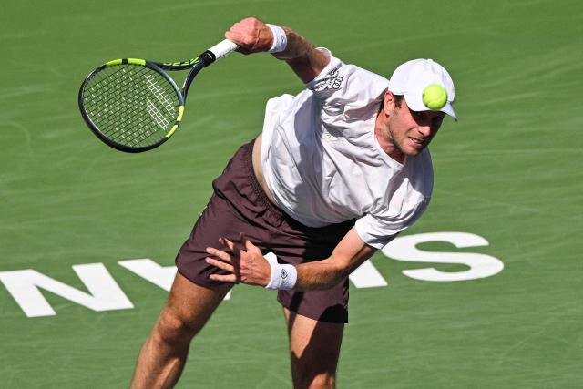 Netherlands' Botic van de Zandschulp serves to Spain's Rafael Jodar during their men's singles match at the Shanghai Masters tennis tournament in Shanghai on October 14, 2026. (Photo by Hector RETAMAL / AFP)