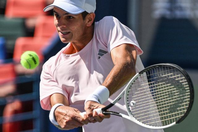 Spain's Rafael Jodar hits a return to Netherlands Botic van de Zandschulp during their men's singles match at the Shanghai Masters tennis tournament in Shanghai on October 14, 2026. (Photo by Hector RETAMAL / AFP)