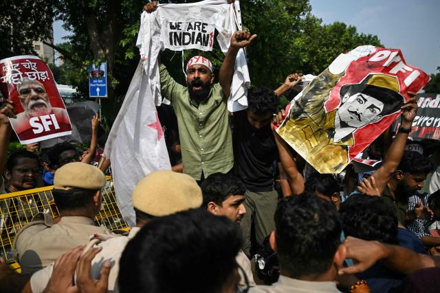 Student activists shout slogans during a protest demanding the resignation of the nation's Chief Election Commissioner Gyanesh Kumar over alleged voter roll irregularities linked to the "special intensive revision" (SIR), in New Delhi on October 14, 2026. (Photo by Arun SANKAR / AFP)